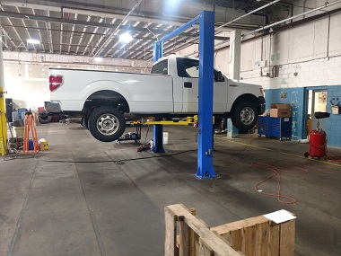 Ford F150 truck on service lift